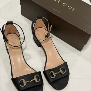 Gucci Black Leather Sandals with Gold Accents